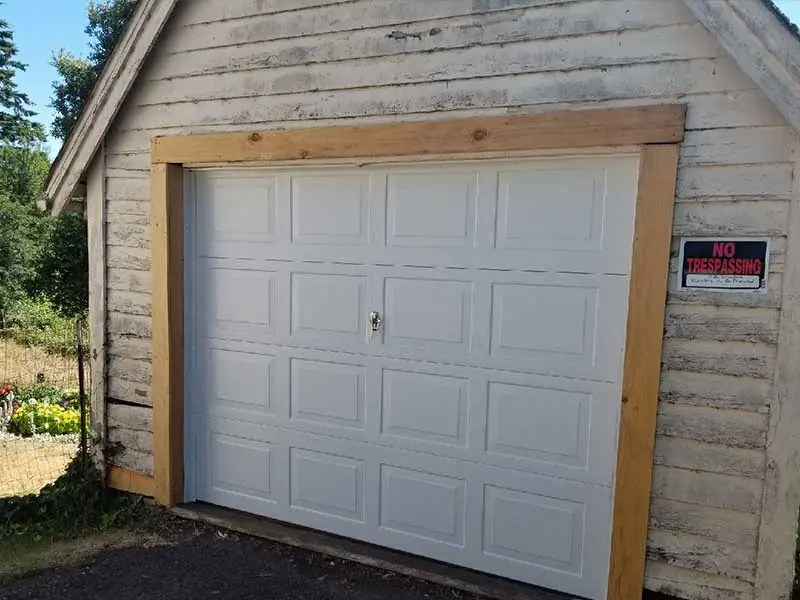 After: Broken shop doors replaced with one panel door