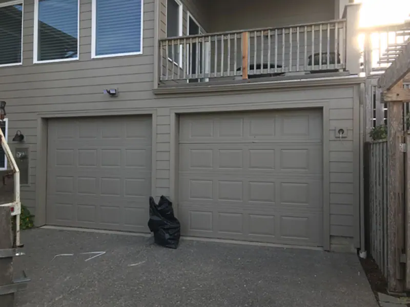 Before: Two plain doors replaced with carriage-style doors