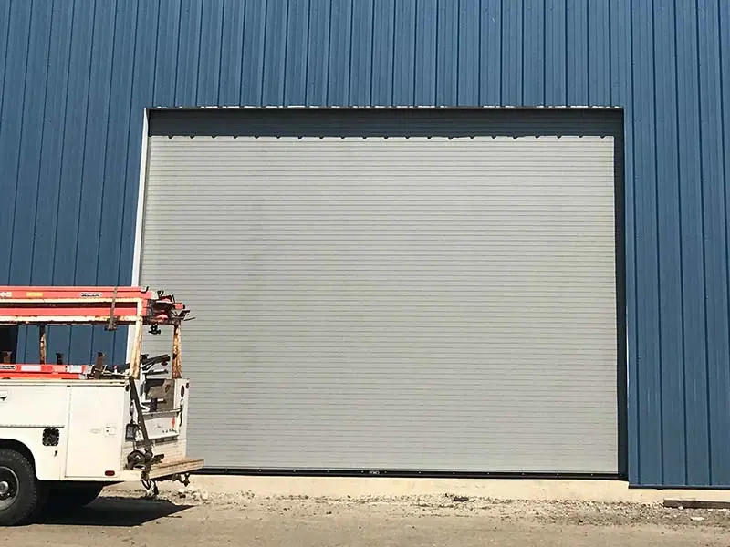 After: Commercial roll-up door on a metal building