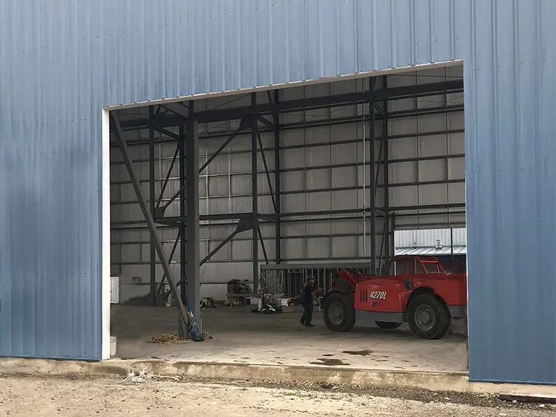 Before: Commercial roll-up door on a metal building
