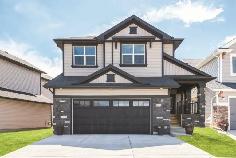 Dark garage door with a window row on a two-storey home