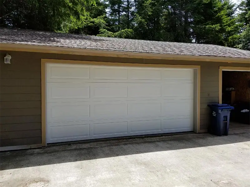 After: Weathered green door replaced in white