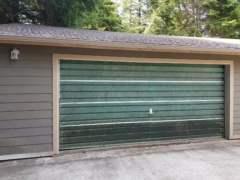 Before: Weathered green door replaced in white